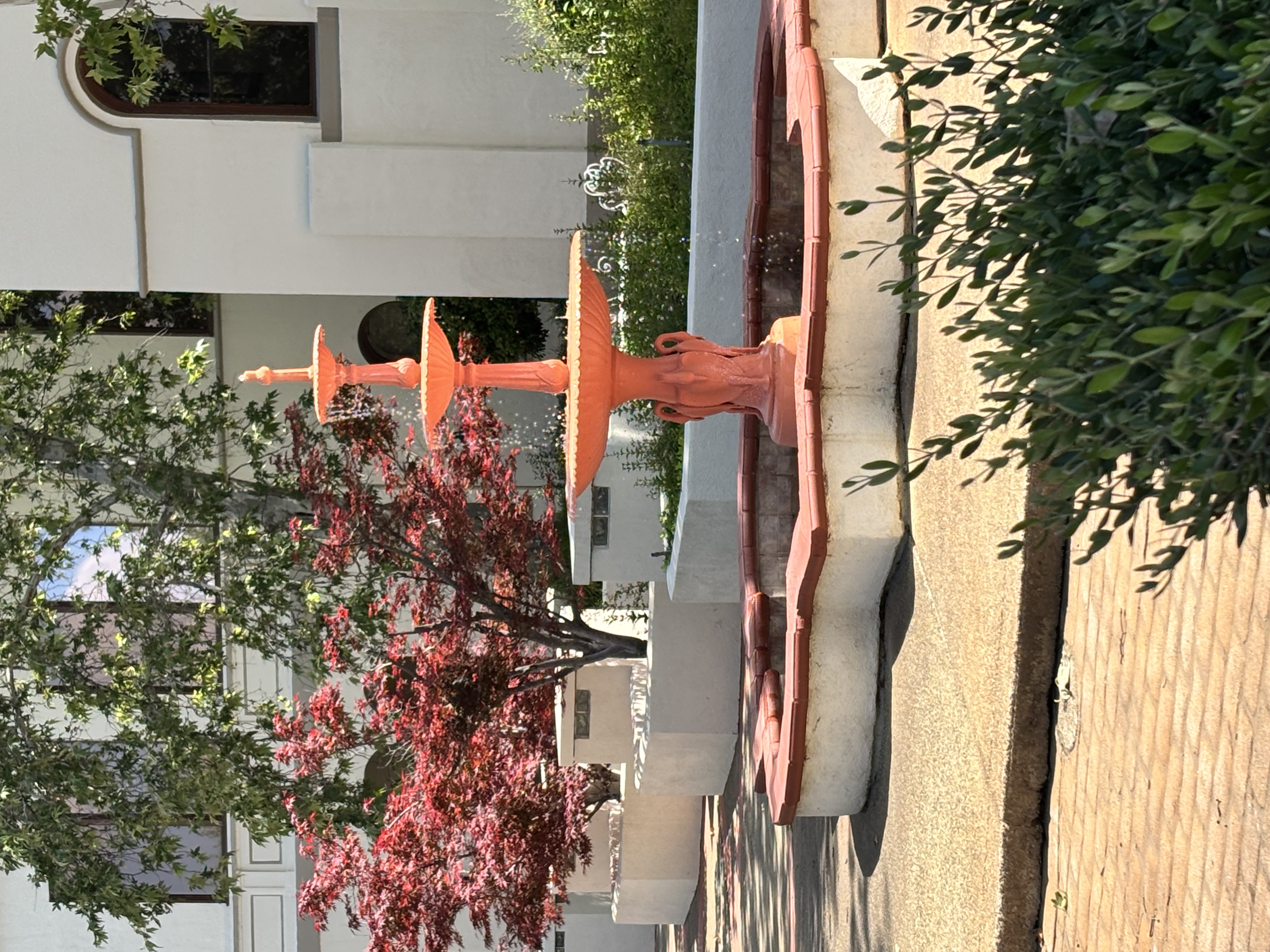 Tiered terracotta fountain outside the Historic Pine Street School Plaza